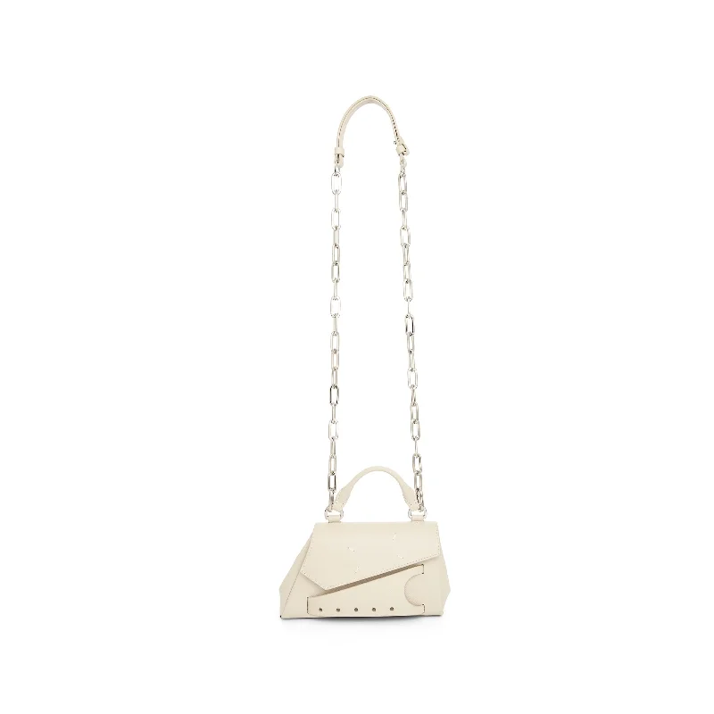 PVC Bucket Bag in Clear with Glitter Accents for a Fun and Edgy StyleMicro Snatched Asymmetric Bag in Greige